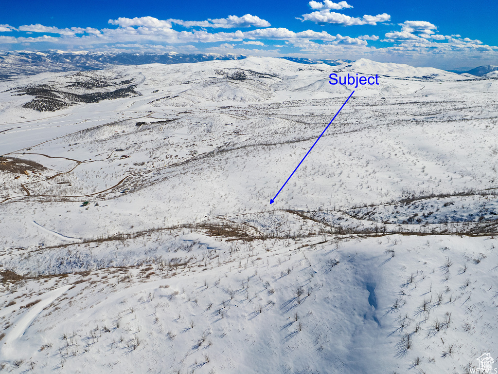 Snowy aerial view with a mountain view