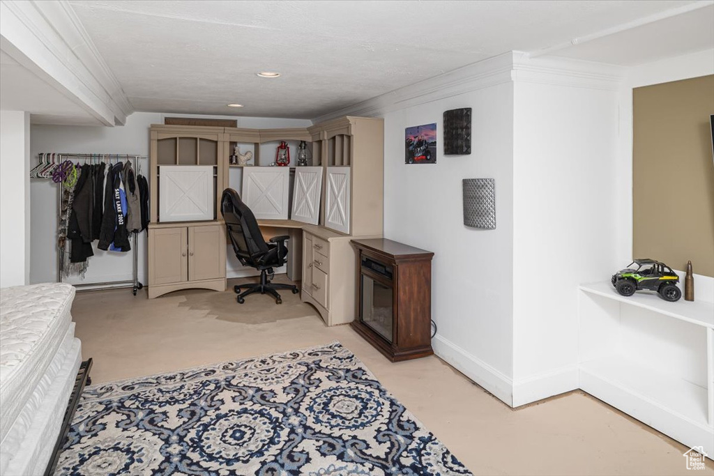 Office space with ornamental molding and built in desk