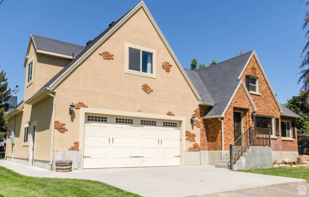 View of front of property featuring a garage