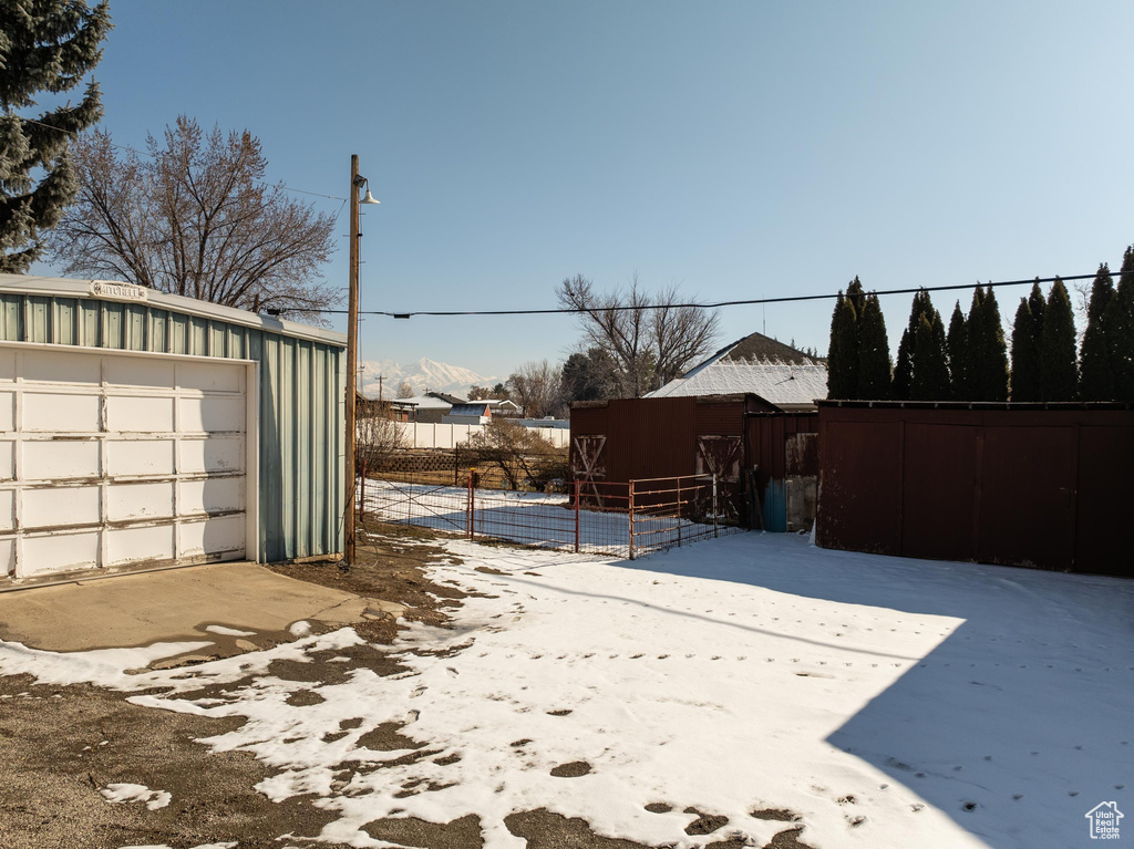 View of yard featuring an outbuilding and a garage