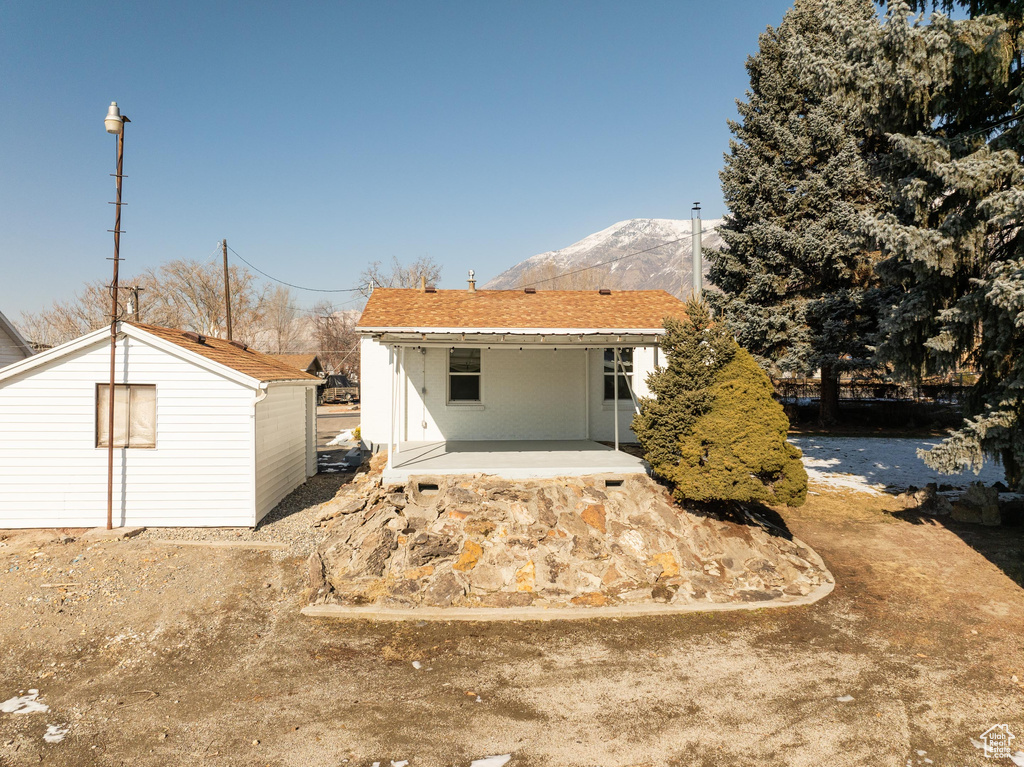 Back of house featuring a mountain view