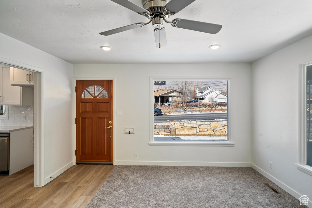 Foyer entrance featuring light hardwood / wood-style floors