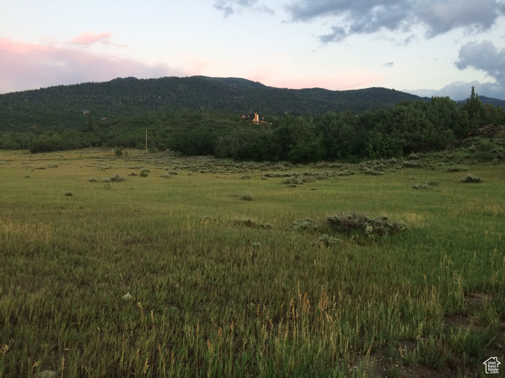 Property view of mountains with a rural view