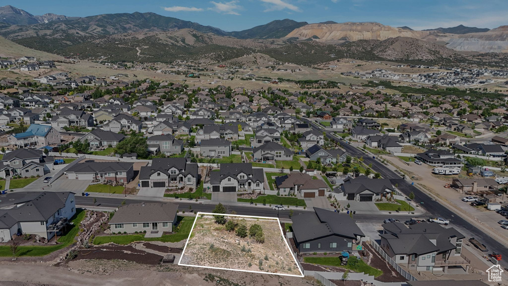 View of property location featuring property boundaries highlighted, nearby suburban area, and a mountain backdrop