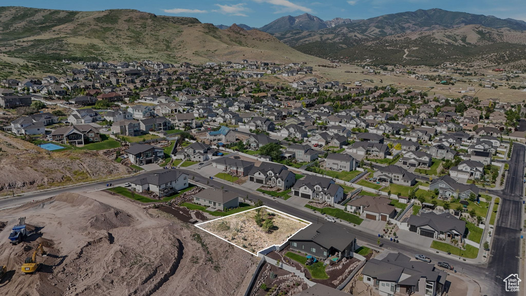 Aerial view of property and surrounding area featuring nearby suburban area and property boundaries highlighted