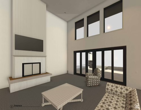 Carpeted living room with a fireplace, a healthy amount of sunlight, and a high ceiling