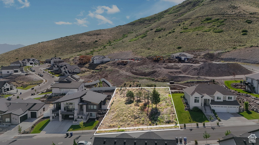 Aerial view of property\'s location with nearby suburban area and property parcel outlined