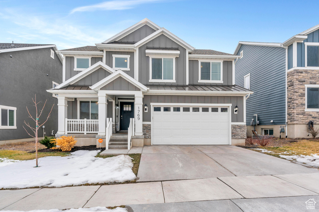 View of front of home featuring a garage