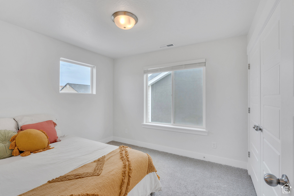 Bedroom with carpet