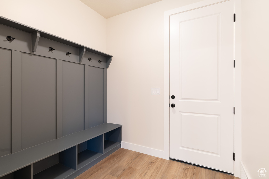 Mudroom with baseboards and light wood-style floors