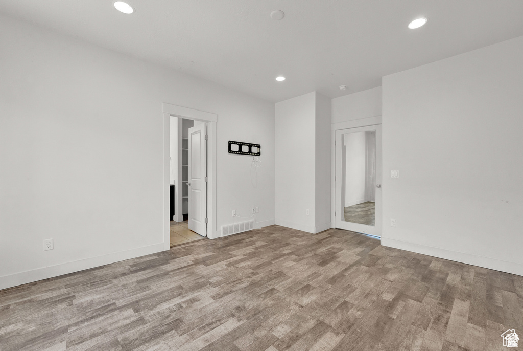 Unfurnished room featuring recessed lighting and light wood-style flooring