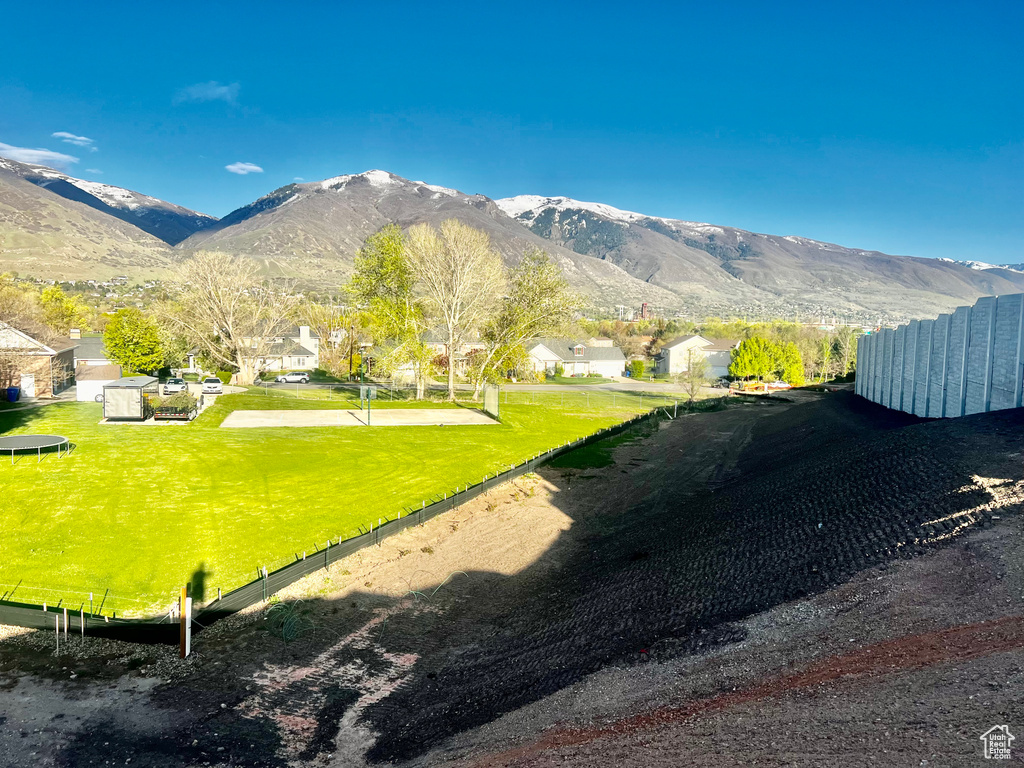 Property view of mountains with a residential view