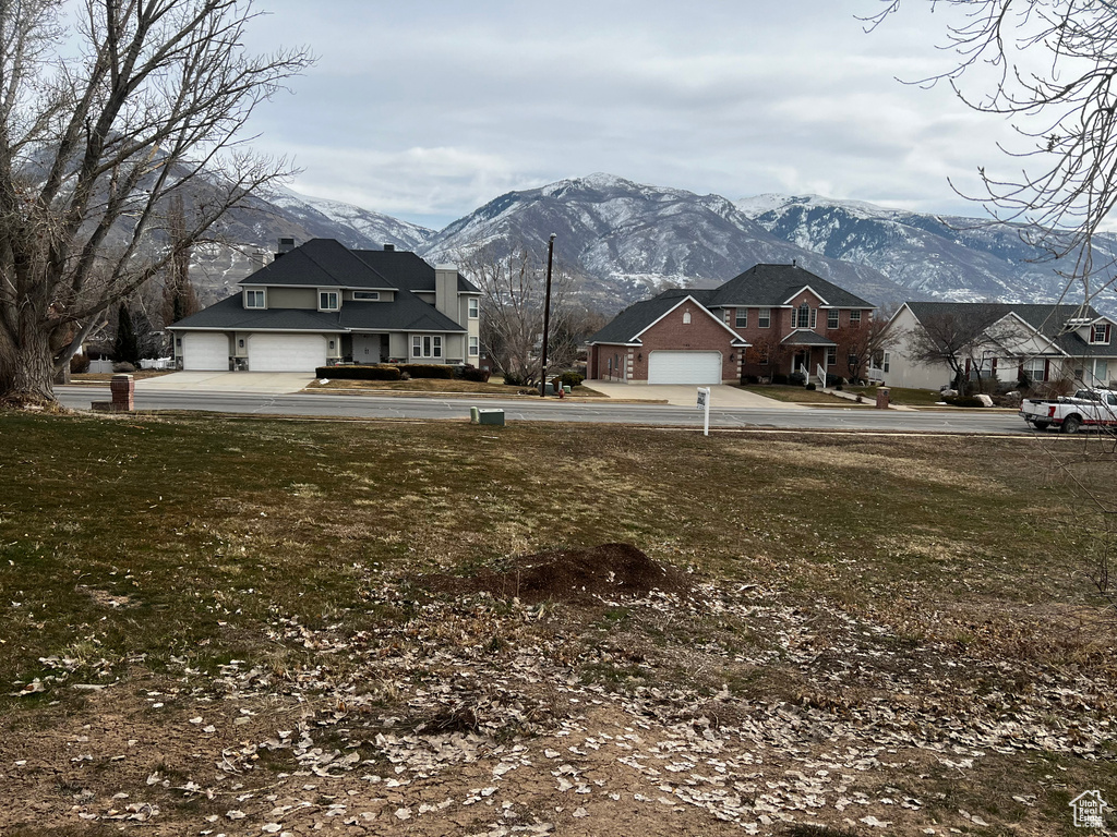 View of yard with a garage and a mountain view