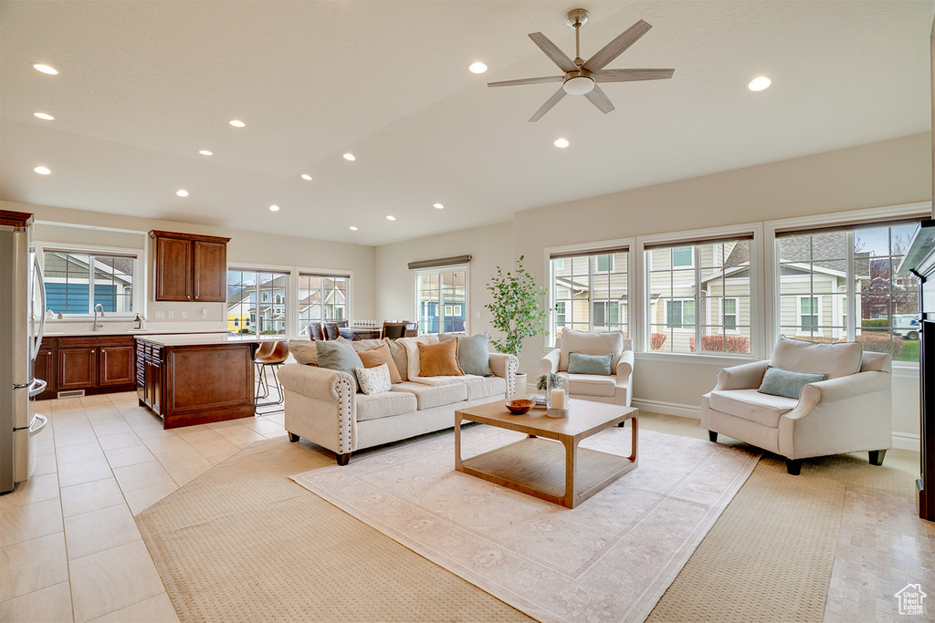 Living room with recessed lighting, a ceiling fan, and light tile patterned floors