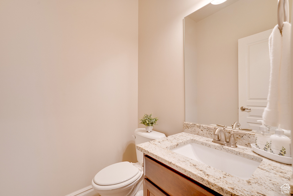 Bathroom featuring vanity and toilet