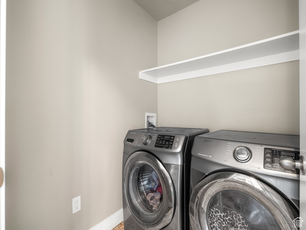 Laundry room featuring washing machine and dryer