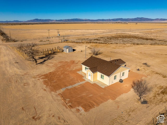 Aerial view of sparsely populated area featuring a desert landscape and mountains