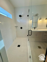 Bathroom with a shower with door