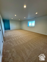 Basement featuring carpet