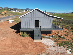 View of outbuilding featuring a mountain view
