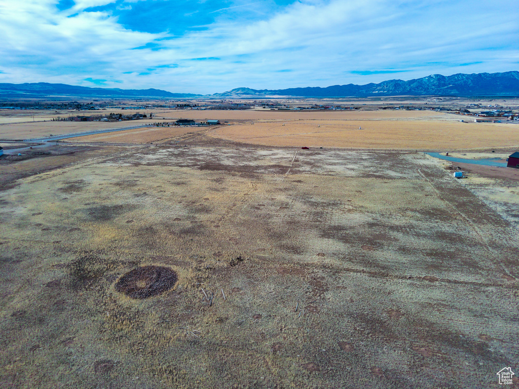 Birds eye view of property with a mountain view