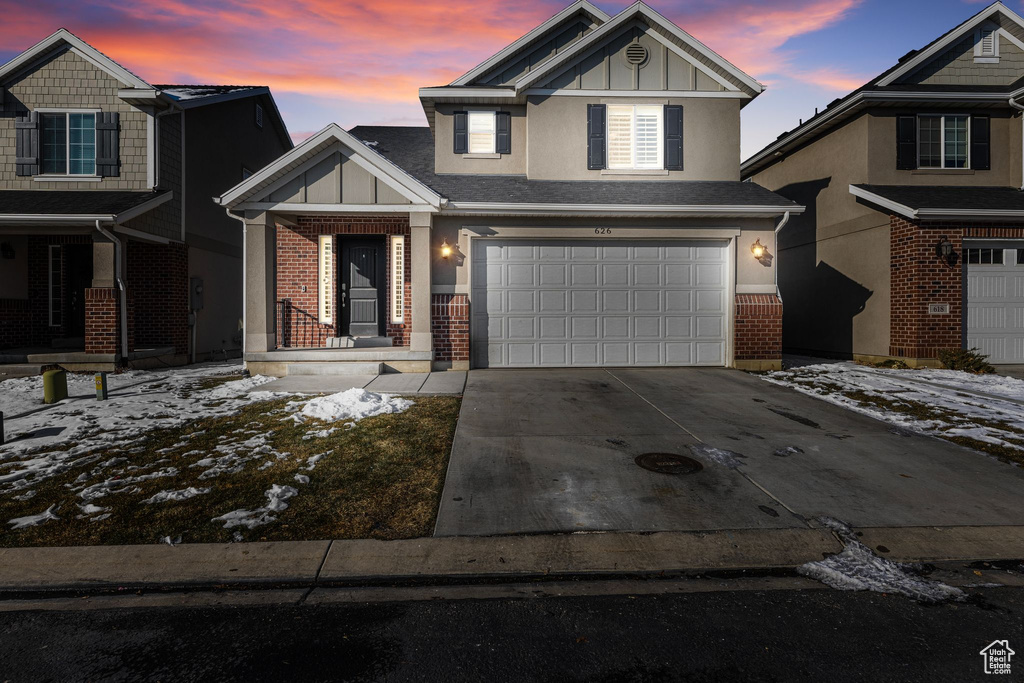 Craftsman-style house featuring a garage