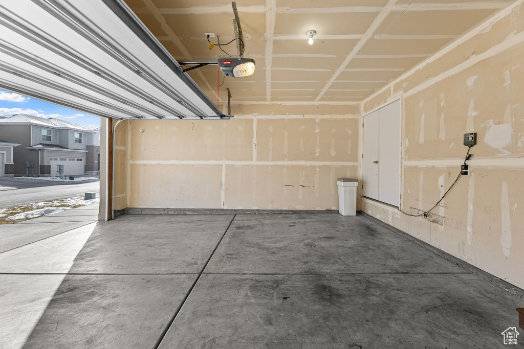 Garage featuring a garage door opener