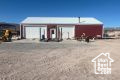 View of outbuilding featuring a garage