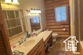 Bathroom with rustic walls