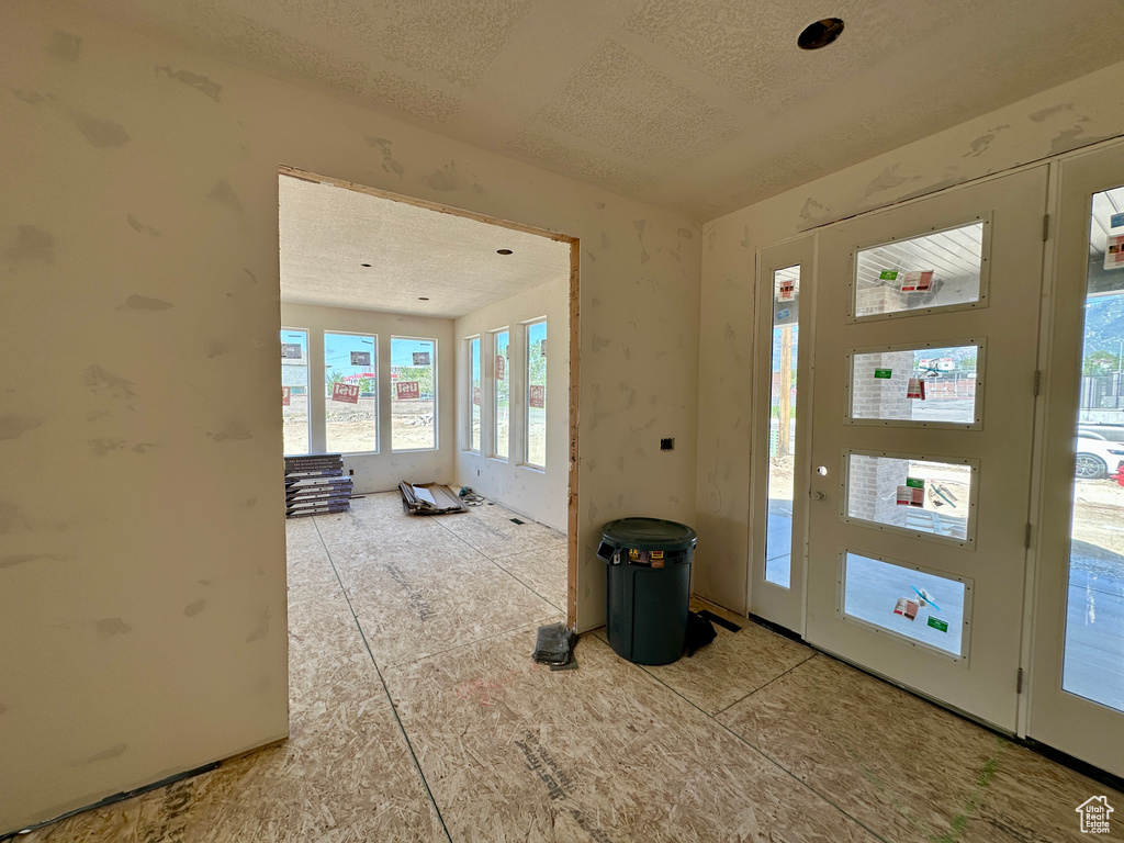 Entrance foyer with a textured ceiling