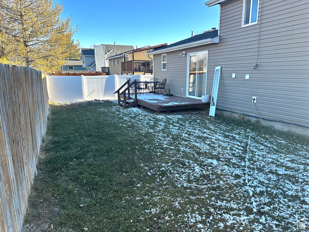 View of yard with a deck