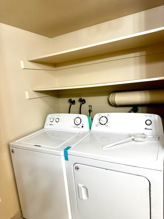 Laundry area featuring washing machine and clothes dryer