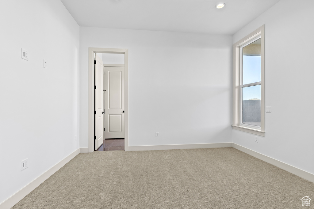 Spare room with carpet floors