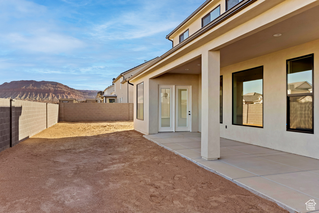 View of yard featuring a mountain view and a patio area