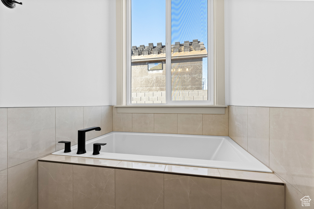 Bathroom with tiled tub