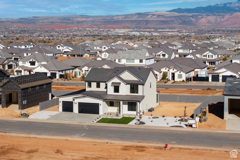 Birds eye view of property with a mountain view