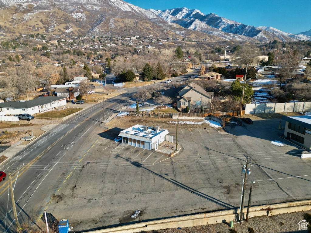 Birds eye view of property with a mountain view