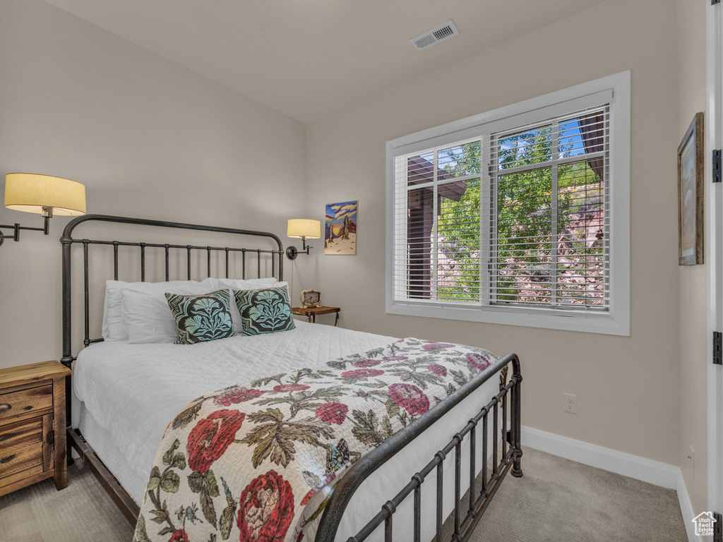 Carpeted bedroom with baseboards