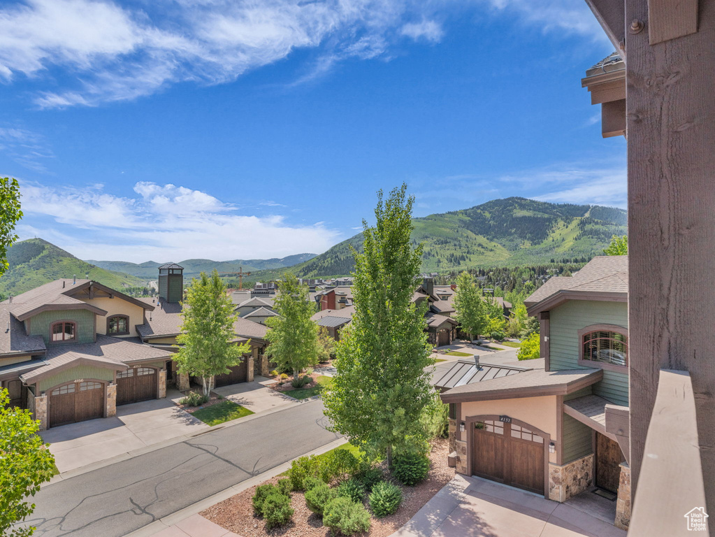 View of mountain backdrop featuring nearby suburban area