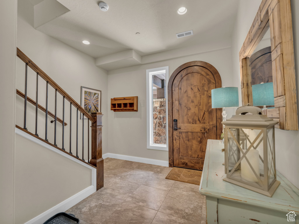 Foyer entrance featuring stairway, recessed lighting, and baseboards