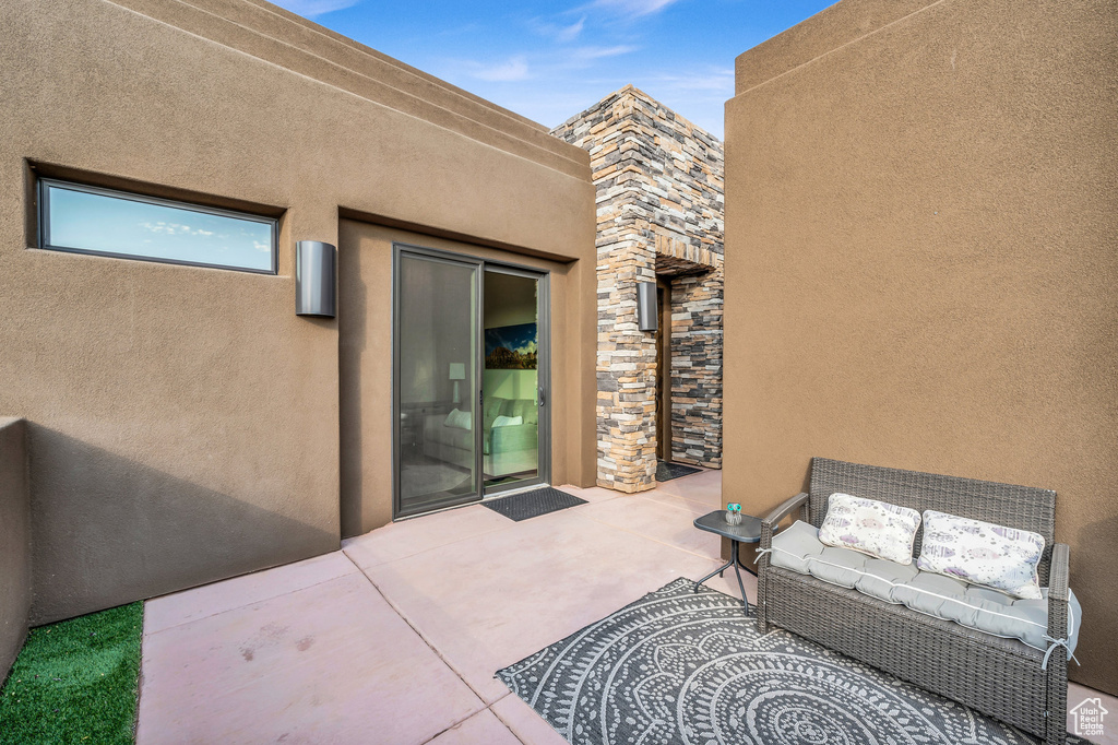 View of patio featuring an outdoor hangout area