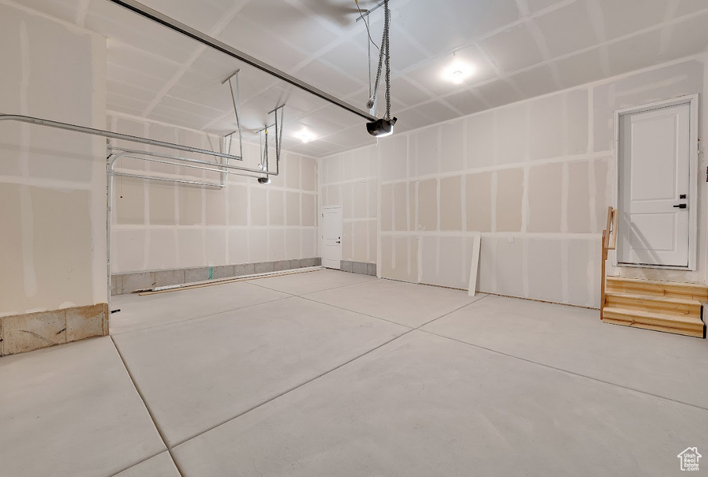 Garage featuring a garage door opener