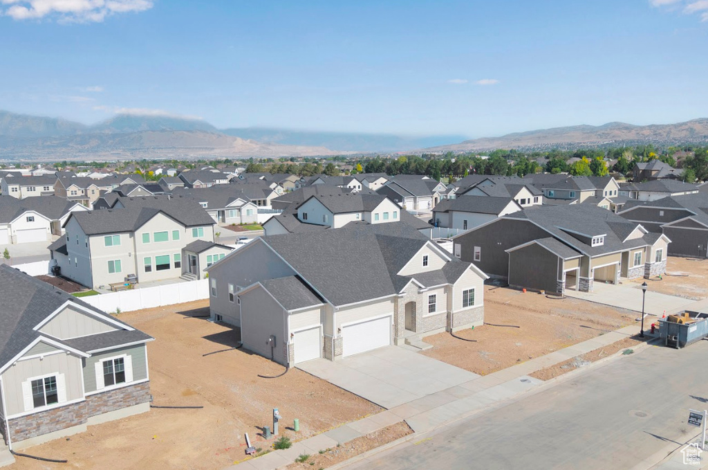 Aerial view of residential area featuring a mountainous background