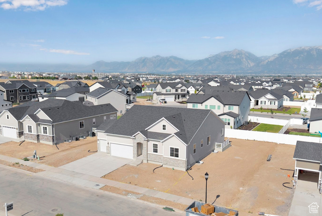 Aerial view of residential area featuring a mountain backdrop