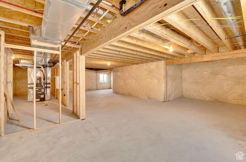 Below grade area featuring heating unit