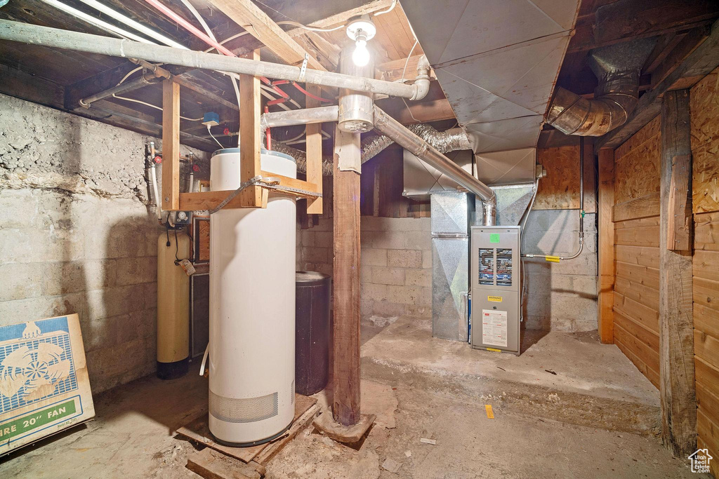 Basement featuring heating unit