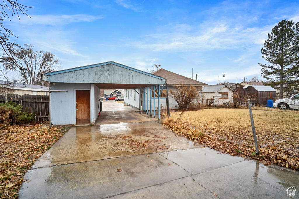 View of front of property with a carport