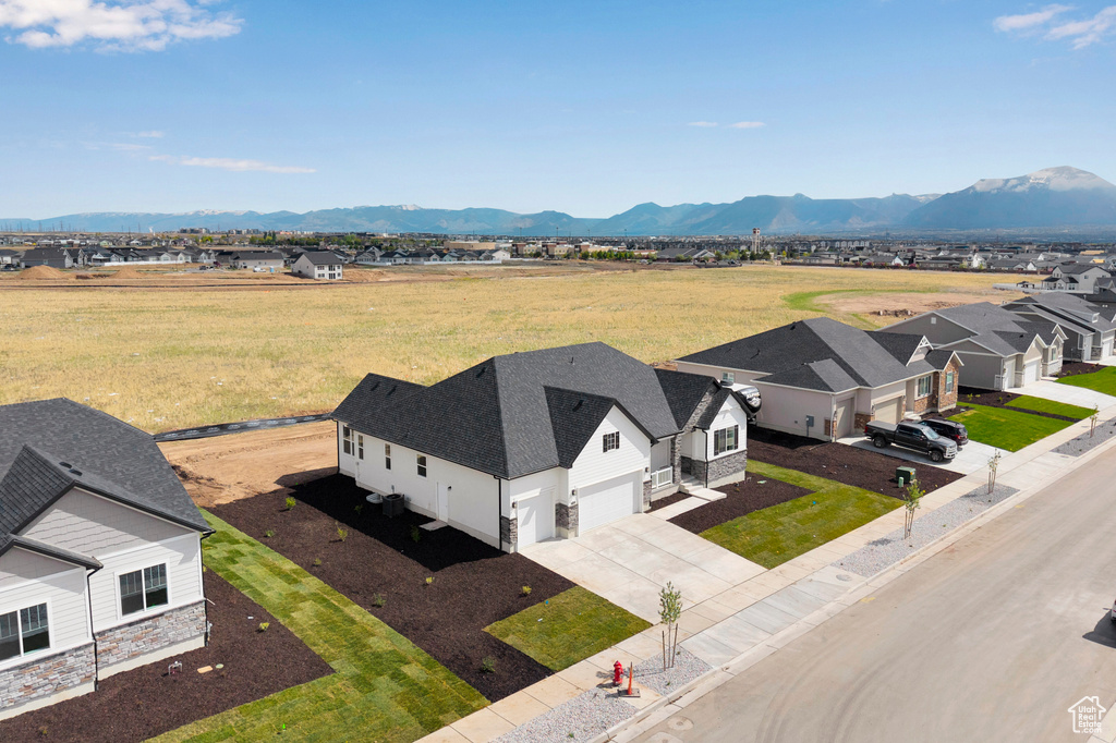 Aerial perspective of suburban area with a mountain backdrop