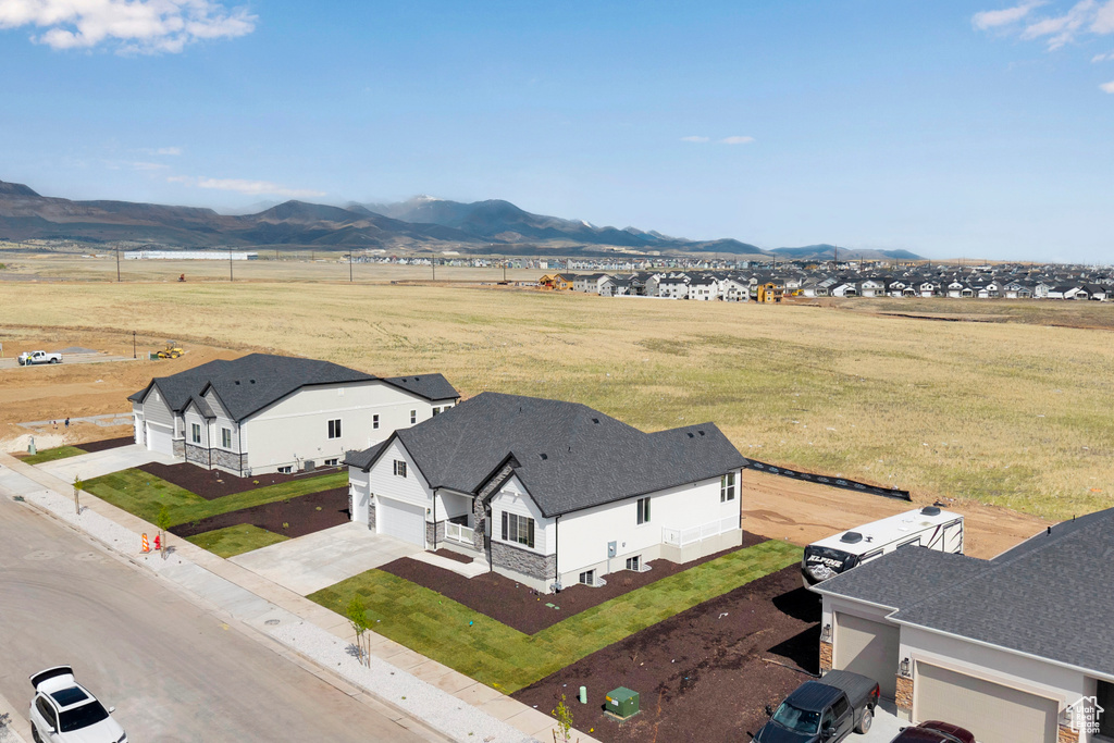 Aerial view of sparsely populated area featuring a mountainous background