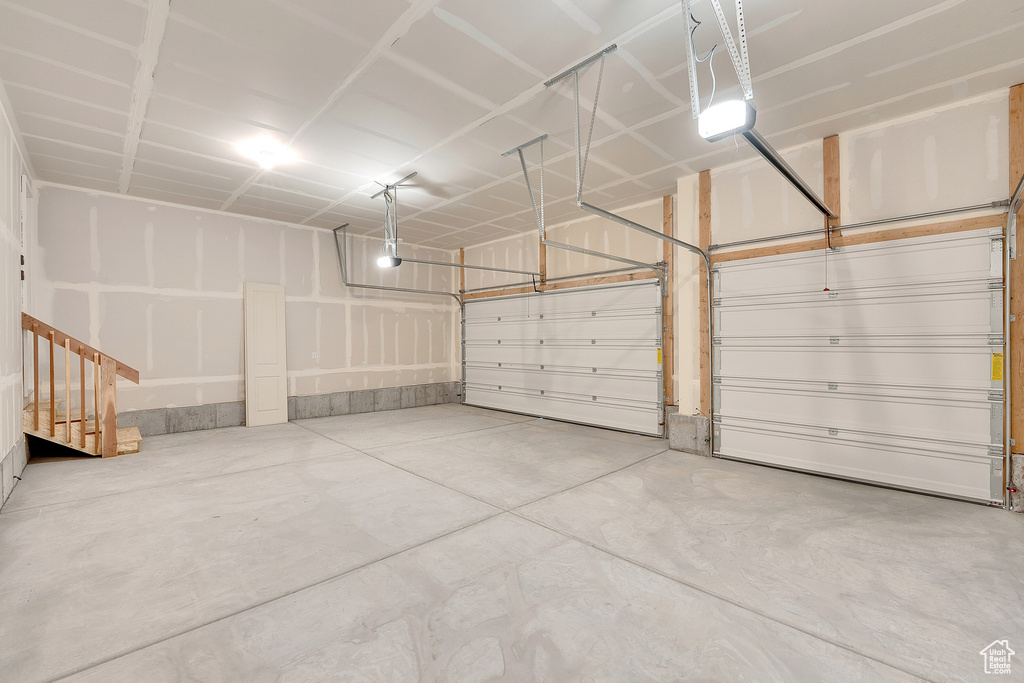 Garage featuring a garage door opener